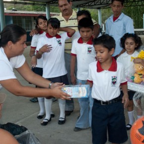 Tanya Jones and Page Cameron distribute gifts for Christmas in 2008