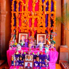 Colorful alters and brightly colored candy commemorating Day of the Dead